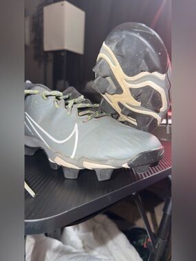 Nike Gray Cleats with White Swoosh and Lime Accents